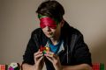 Rubik's cube genius Jayden McNeill can now solve the puzzle while wearing a blindfold.