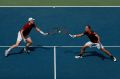 NEW YORK, NY - SEPTEMBER 10: Jamie Murray (L) of Great Britain and Bruno Soares (R) of Brazil return a shot to Pablo ...