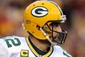 LANDOVER, MD - JANUARY 10: Quarterback Aaron Rodgers #12 of the Green Bay Packers looks to pass while under pressure ...