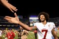 Polarising figure: San Francisco 49ers quarterback Colin Kaepernick shakes hands with fans after the 49ers defeated the ...