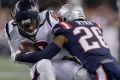 Doing damage: New England Patriots cornerback Logan Ryan tackles Houston Texans wide receiver DeAndre Hopkins.