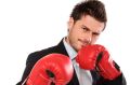 business man wearing boxing gloves ready for tough opposition , isolated on white background. ISTOCK Boxing Business ...