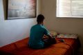 A 15-year-old boy from El Salvador in his uncle's home in Tucson, Arizona this month. He is asking for asylum after ...
