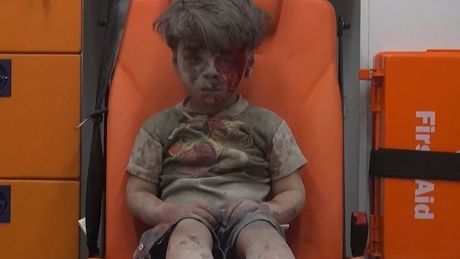 Omran Daqneesh sits in an ambulance after being pulled out of a building hit by an air strike in Aleppo, Syria, on August 17.