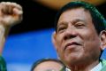 Philippine President Rodrigo Duterte does this trademark fist bump.