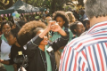 Schoolgirls protest school hair rules that they claim are discriminatory against black students. 