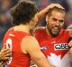 Buddy brilliant: Lance Franklin celebrates with team mates.