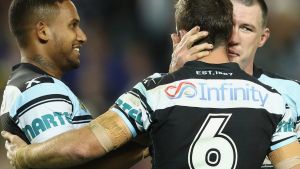 SYDNEY, AUSTRALIA - SEPTEMBER 23: Ben Barba, James Maloney and Paul Gallen of the Sharks celebrate Maloney scoring a try ...