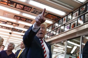 Republican presidential candidate Donald Trump talks with customers during a visit to Geno's Steaks, Thursday, Sept. 22, 2016, in Philadelphia.