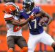 Tramon Williams of the Cleveland Browns tackles wide receiver Mike Wallace of the Baltimore Ravens.