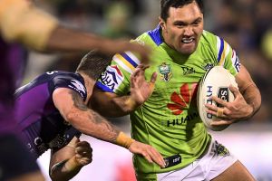 Jordan Rapana takes on the Melbourne Storm defence at GIO Stadium in Round 23.