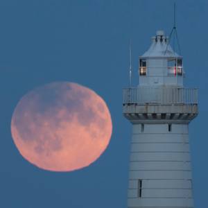 Harvest moon and Penumbral Lunar Eclipse on Friday 16 Sept 2016 at Donaghadee lighthouse. Picture by Bernie Brown