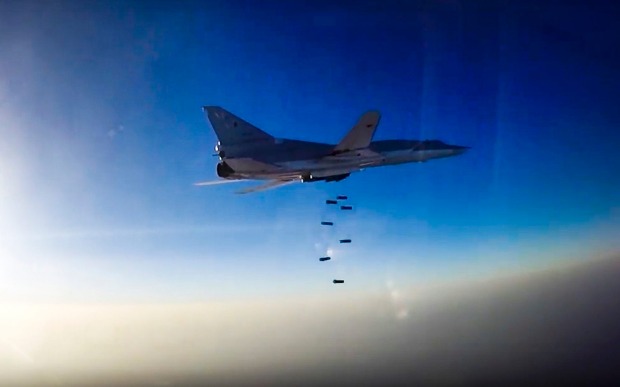 A Russian long range bomber flies during an air strike over Aleppo. The region is a battleground for the major nations.