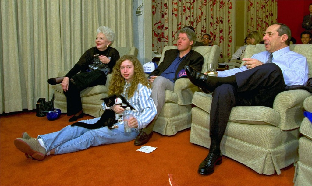 President Clinton, flanked by Govs. Ann Richards of Texas and Mario Cuomo of New York, watches the Dallas Cowboys and the Buffalo Bills Super Bowl with his daughter, Chelsea and her cat, Socks, in the family theater Sunday, January 31, 1993, at the White House. (AP Photo/Wilfredo Lee)