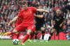 LIVERPOOL, ENGLAND - SEPTEMBER 24:  James Milner of Liverpool scores his sides fith goal during the Premier League match ...