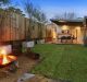 1178 Botany Road, Botany: A covered deck gives way to a level lawn with a feature fire pit.