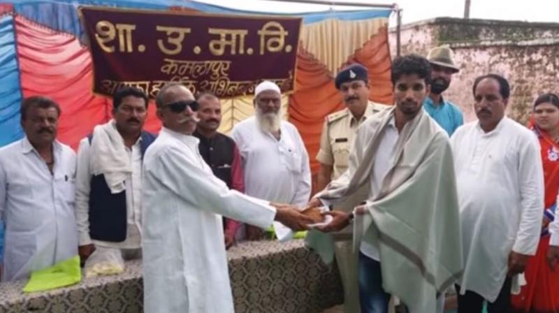 Ansar Khan (right) was arrested on Friday for faking a job at NASA and forging President Barack Obama's signature. (Photo: YouTube screen grab)