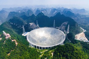 In this Saturday, Sept. 24, 2016 photo released by Xinhua News Agency, an aerial view shows the Five-hundred-meter Aperture Spherical Telescope (FAST) in the remote Pingtang county in southwest China's Guizhou province. China has begun operating the world's largest radio telescope to help search for extraterrestrial life.