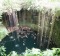 Swimming in the magnificent Grand Cenote, just outside of Tulum, Mexico.