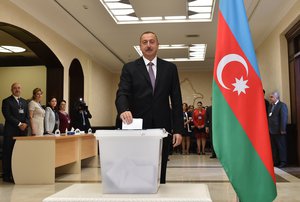 Azerbaijani President Ilham Aliyev casts his ballot at a polling station during a referendum in Baku, Azerbaijan on Monday, Sept. 26, 2016. The Monday vote is on proposals including raising the presidential term from five years to seven.