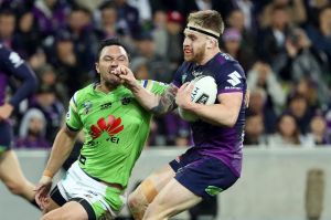 Tough win: Cameron Munster is challenged by Jordan Rapana on Saturday night.