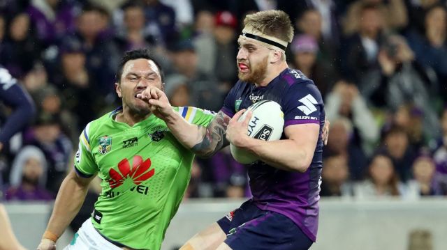 Tough win: Cameron Munster is challenged by Jordan Rapana on Saturday night.