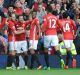 Juan Mata is congratulated after scoring a peach for Manchester United.