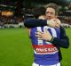 Emotional: Injured Bulldogs skipper Bob Murphy embraces his stand-in, Easton Wood, after the game.