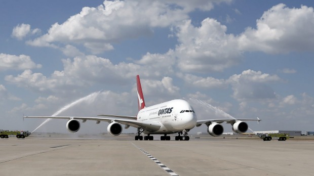 A Qantas A380 taxis to its gate during its inaugural landing at Dallas-Fort Worth International Airport in Texas after ...