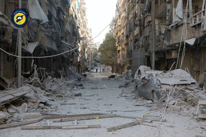 In this photo provided by the Syrian Civil Defense group known as the White Helmets,  shows heavily damaged buildings after airstrikes hit in Aleppo, Syria, Saturday, Sept. 24, 2016.