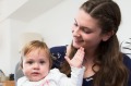 Au pair Annika Abraham with her host family Matthew Eglan, Amanda Buckland and one-year-old Lucy, in their Sydney home. 