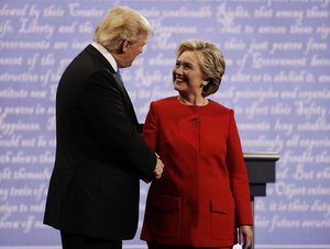 Democratic presidential nominee Hillary Clinton shakes hands with Republican presidential nominee Donald Trump during the presidential debate at Hofstra University in Hempstead, N.Y., Monday, Sept. 26, 2016.