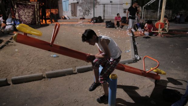 A Syrian migrant in a park in the coastal town of Bodrum, Turkey, waiting for the chance to cross with boats to the ...