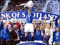 Barry Ferguson holds the SPL trophy aloft