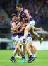 Tom Liberatore, Marcus Bontempelli, Dale Morris and Josh Dunkley of the Bulldogs celebrate victory.