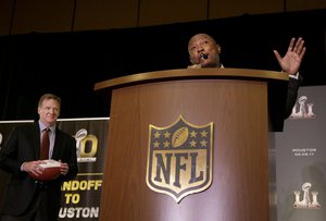 NFL Commissioner Roger Goodell, left, listens as Houston Mayor Sylvester Turner speaks at a news conference in San Francisco, Monday, Feb. 8, 2016.