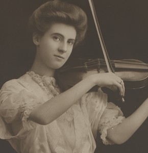 Black and white photo of a woman playing a violin