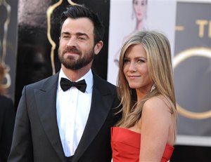 Actors Justin Theroux, left, and Jennifer Aniston arrive at the Oscars at the Dolby Theatre on Sunday Feb. 24, 2013, in Los Angeles.