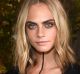 Cara Delevingne wearing Burberry at the Burberry September 2016 show during London Fashion Week SS17 at Makers House on ...