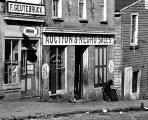 File - A slave trader's business in Atlanta, Georgia, 1864. Slavery in the US was the legal institution of human chattel slavery that existed in America in the 18th and 19th centuries.