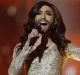 AP10ThingsToSee - Singer Conchita Wurst, representing Austria, performs the song "Rise Like a Phoenix" during a ...