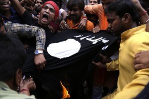 ISIS activities while burning an ISIS flag during a protest