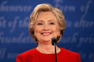 Democratic U.S. presidential nominee Hillary Clinton smiles during the first presidential debate with Republican U.S. presidential nominee Donald Trump at Hofstra University in Hempstead