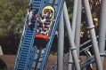 Several roller-coaster riders are helped out of the ride at Sea World.