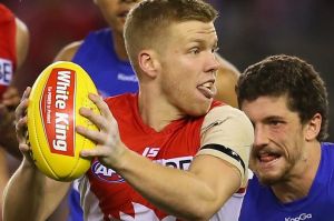 Manic midfields: Daniel Hannebery of the Swans and Tom Liberatore of the Bulldogs.