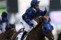 Damian Browne on Australian horse Buffering crosses the finish line to win the U.S. $ 1,000,000 Al Quoz Sprint of the ...