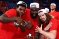 Wildcats' Casey Prather, Nate Jawai and Greg Hire display their rings after winning the NBL championship.