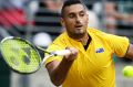 SYDNEY, AUSTRALIA - SEPTEMBER 16: Nick Kyrgios of Australia plays a forehand with his nose plugged due to a nose bleed ...