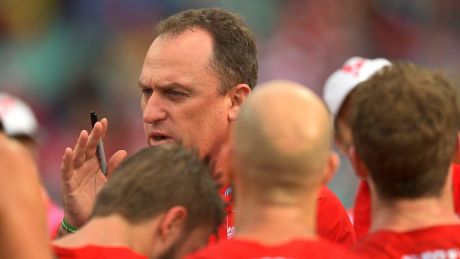 Swans coach John Longmire speaks to the players at half time during the round 20 match against Port Adelaide Power.