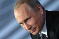 Russian President Vladimir Putin listens for a question during his annual call-in show in Moscow, Russia, Thursday, ...